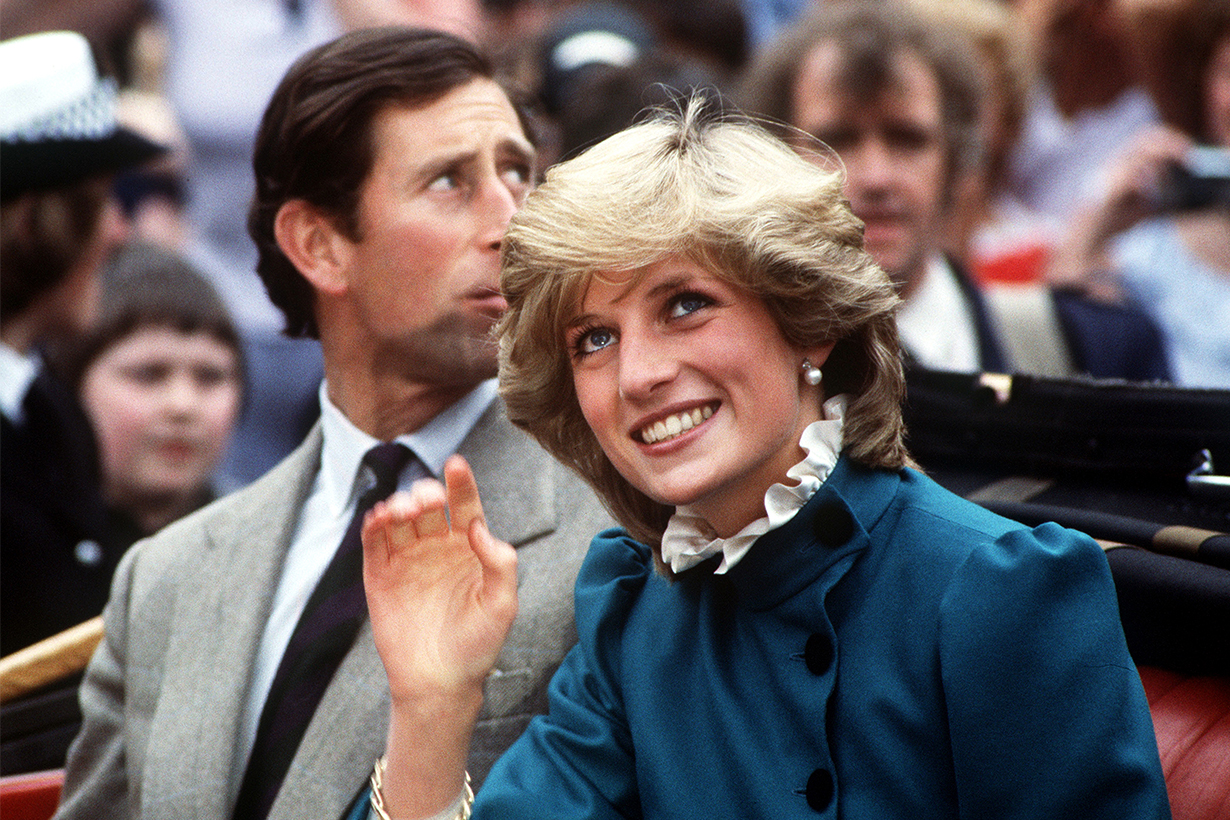 Princess Diana (1961 - 1997) in an open-top carriage with Prince Charles in St Columb, Cornwall, May 1983. The princess is wearing a green wool suit and cream ruffle blouse by Caroline Charles