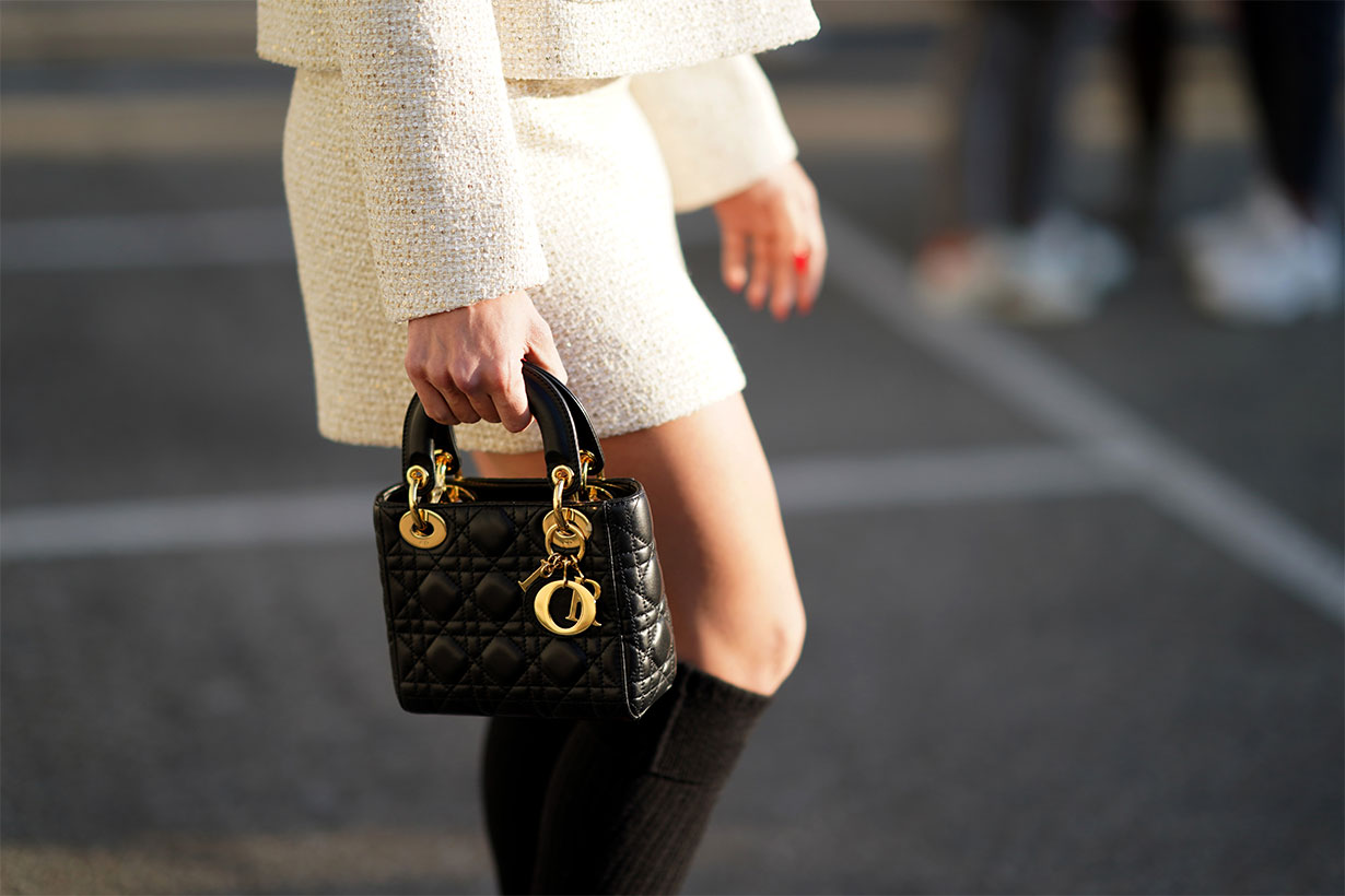 A guest wears a black leather quilted Lady Dior bag, outside Alberta Ferretti, during Milan Fashion Week Fall/Winter 2020-2021, on February 19, 2020 in Milan, Italy.