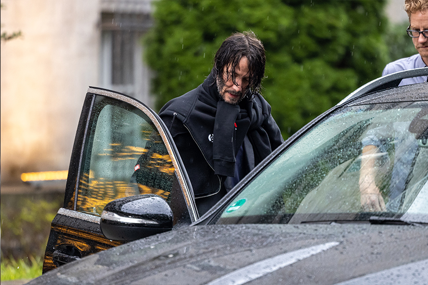 Keanu Reeves sports wet hair exiting hotel Berlin John Wick 4